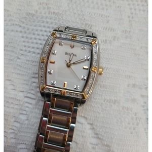 Woman's Bulova watch with diamond bezel, 2 toned.